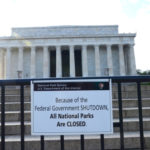 Lincoln Memorial behind fence with sign saying closed for shutdown