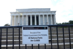 Lincoln Memorial behind fence with sign saying closed for shutdown