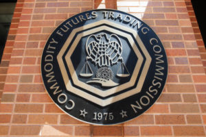 Cast metal seal of CFTC on brick wall