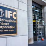 Metal sign for International Finance Corporation World Bank Group at entrance to building