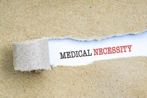 Paper Ripped Uncovering Medical Necessity Wording