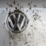 Volkswagen Car Logo with Splatters of Dirt