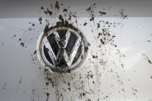 Volkswagen Car Logo with Splatters of Dirt