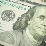hundared dollar bill zoomed in to president's face