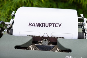 typing of word bankruptcy on typewriter