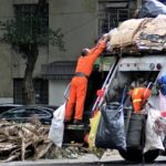Garbage Truck Men Loading Trash Behind Truck