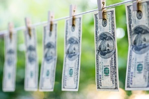 Hundred dollars bills pinned to clothes line