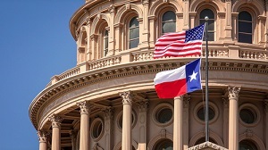 Texas Capital Building with United States Flag and Texas State Flag