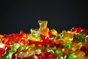 Stack of Multicolored Gummy Bears with One Standing
