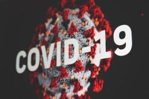 Virus with COVID-19 Lettering Over