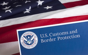 US Customs and Border Protection Flyer Behind US Flag