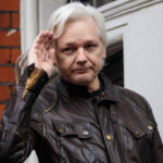 Julian Assange waving to public May 2024